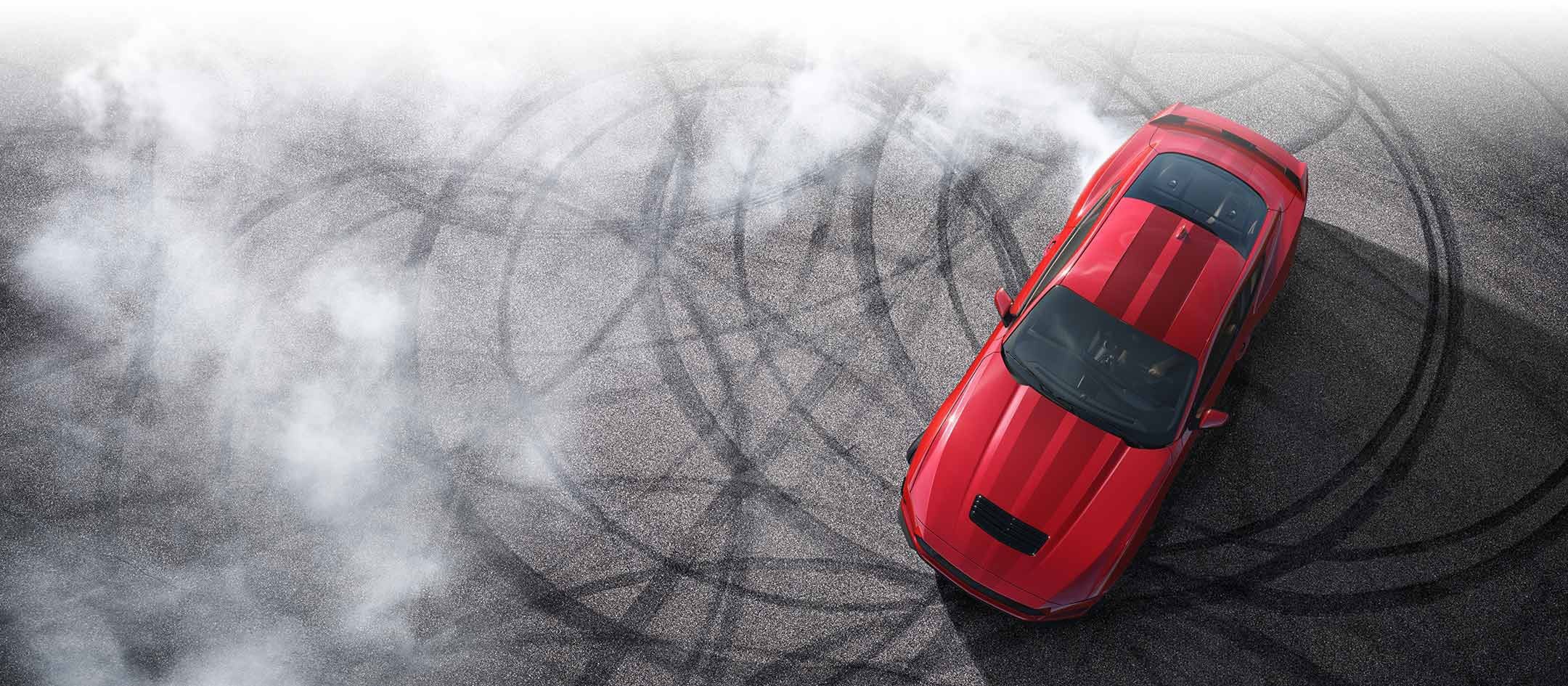 Overhead view of a 2024 Ford Mustang® model with tire tracks on pavement | Bob Poynter Ford, Inc. in Seymour IN