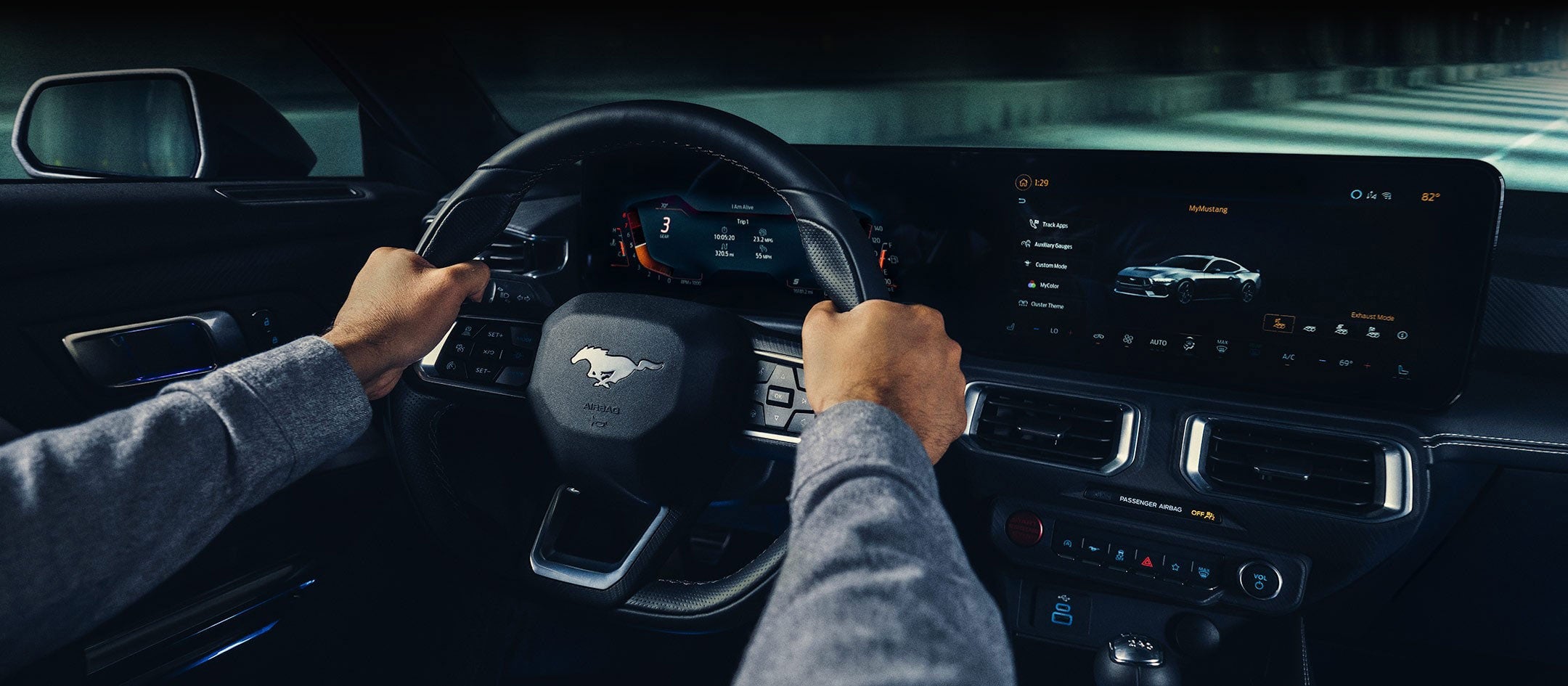 A 2024 Ford Mustang® model interior with a person driving | Bob Poynter Ford, Inc. in Seymour IN