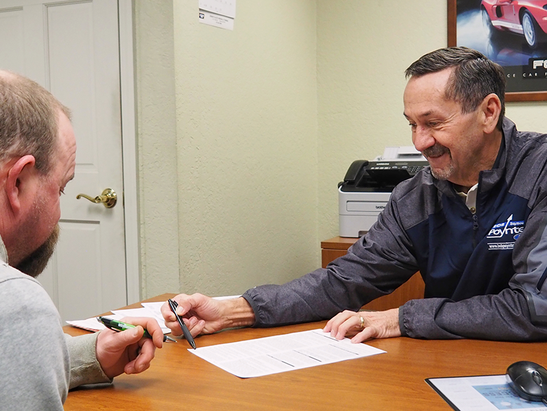 image of a salesman working with a client